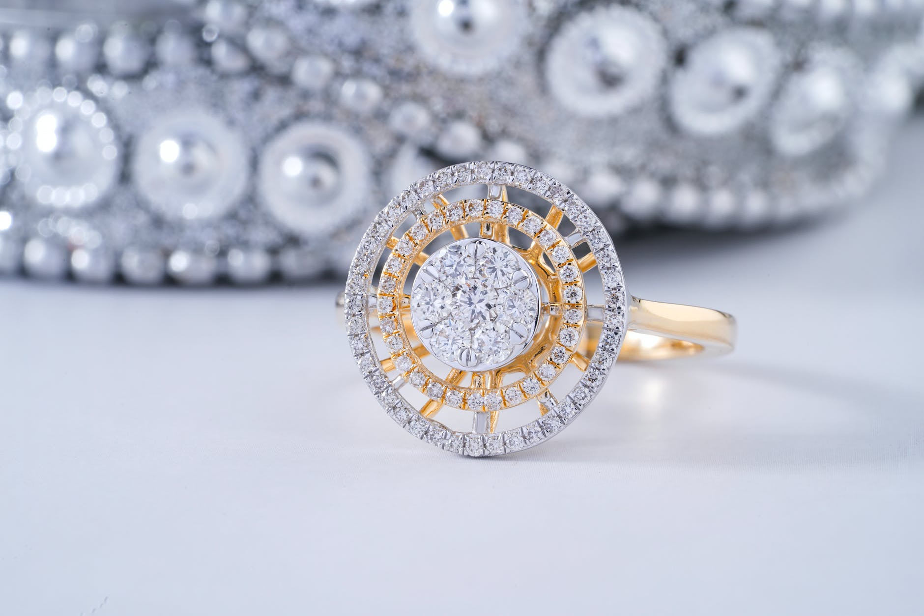 silver and gold round accessory