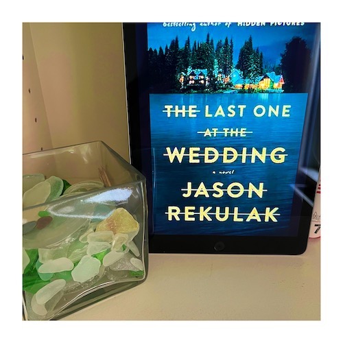 Original photo of The Last One at the Wedding by Jason Rekulak on a shelf with a jar of beach glass