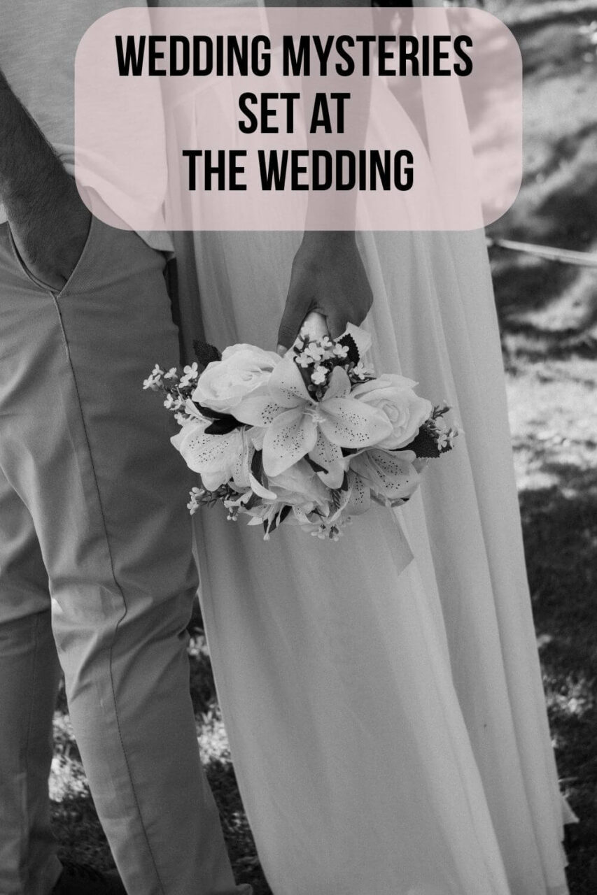A black and white photo of a woman in a wedding dress holding flowers and a man in a suit