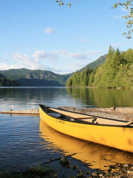 Spoiler Discussion for Verity: the canoe. A yellow canoe floats on a mountain lake