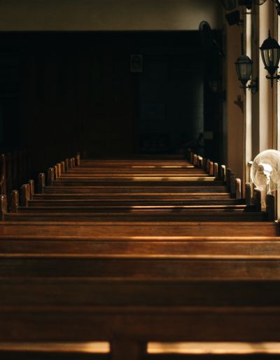 Empty chapel or church with wooden pews