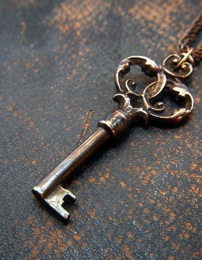 Spoiler Discussion Post for Daisy Darker: the group finds a key to the cupboard under the stairs. Photo of an old fashioned key on a cord.