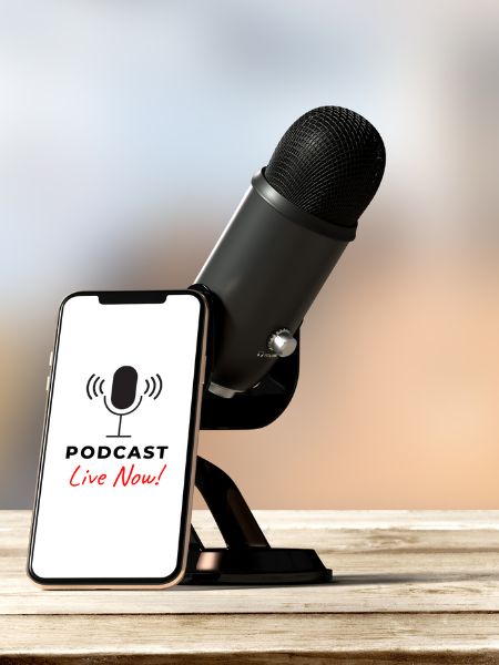 Podcasts are an important part of the Good Girl's Guide to Murder. A podcasting microphone and a phone that says "podcast live."