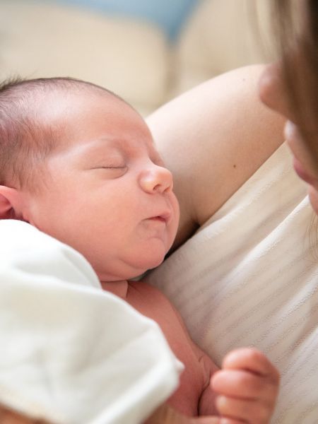 Woman holding a newborn baby