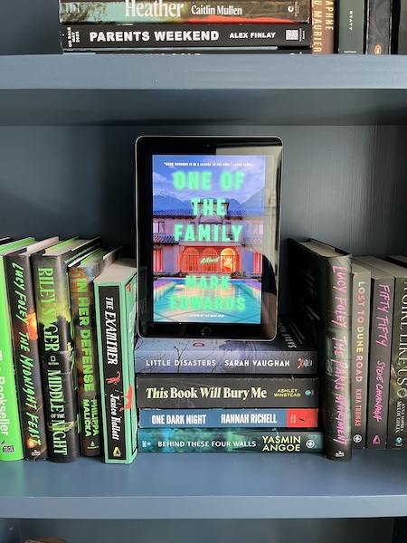 One of the Family b y Mark Edwrds on a bookshelf
