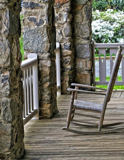 Photo of a rocking chair on a porch