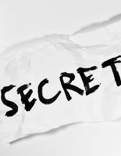 The word "secret" on a crumpled piece of paper