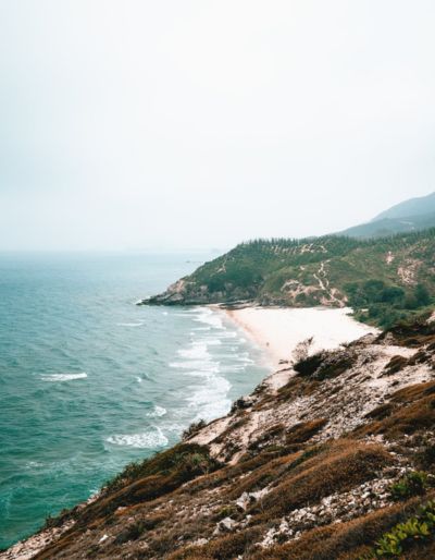 Scene of the rugged Washington state coastline featuring a rocky coast and crashing waves