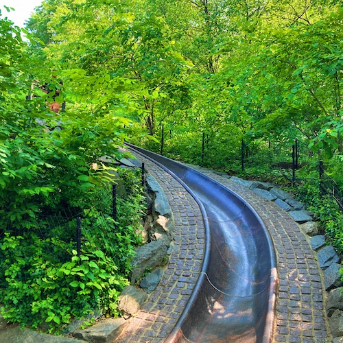Photo of the stone slide at the Billy Johnson Playground in Central Park. Photo by Jen Ryland LLC.