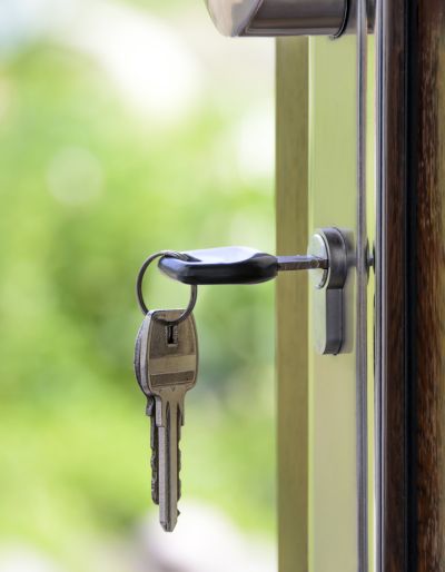 A key in the outside lock of a door.