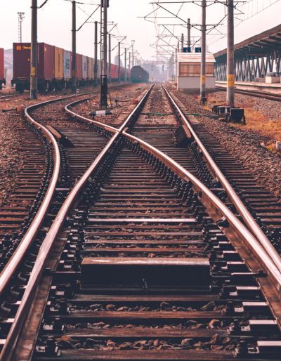 A picture of train tracks criss-crossing at a train yard.