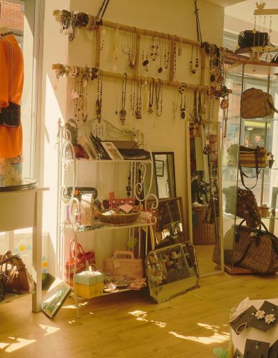 Photo of clothing and jewelry for sale at a charity shop or boutique