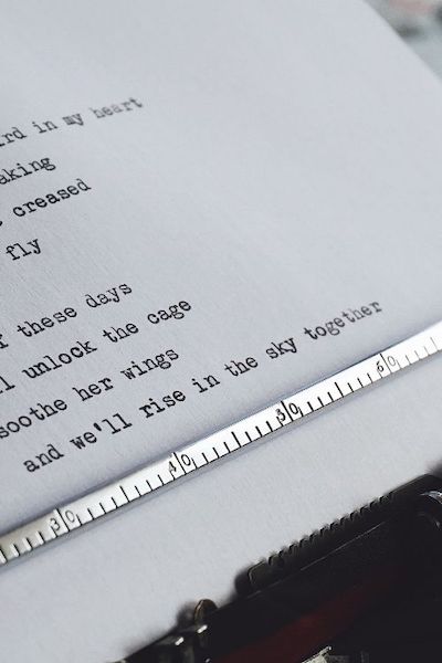 Typewriter holding some typed lines of poetry