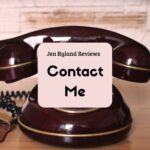 My contact me page graphic shows a black old fashioned landline with gold trip.