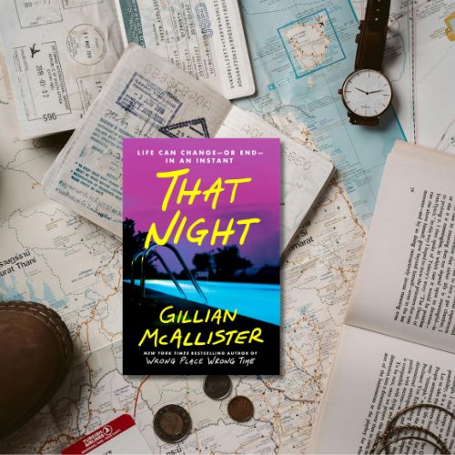 A copy of That Nights, which shows a dark road a night, on top of maps, coins and a passport