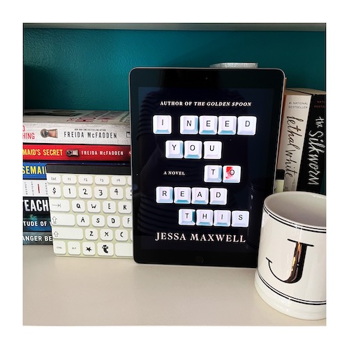 Original photo of a copy of I Need You To Read This on a shelf in front of a computer keyboard