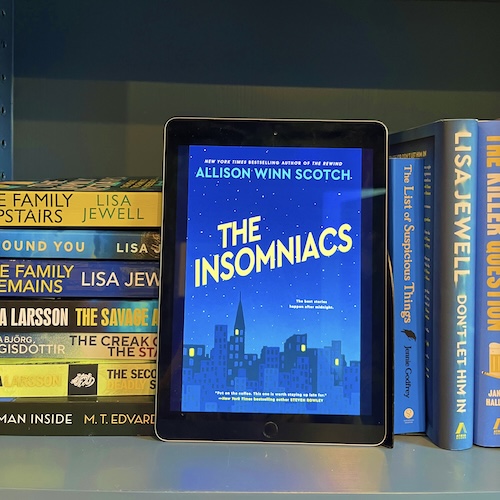 Square photo of THE COVER OF THE INSOMNIACS BY ALLISON WINN SCOTCH ON A SHELF NET TO OTHER BLUE AND YELLOW BOOKS