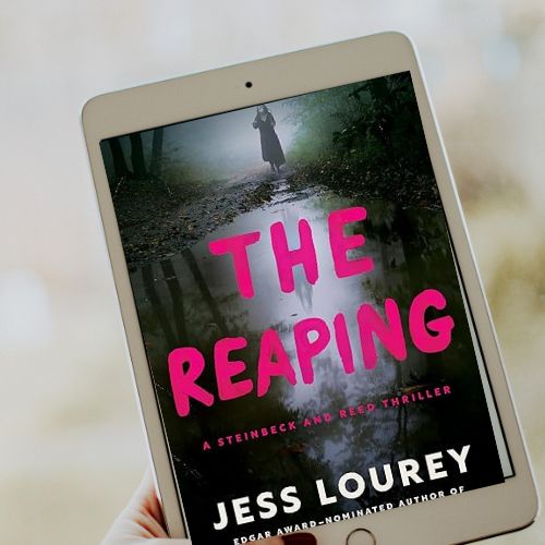 A copy of The Reaping by Jess Lourey on an e-reader