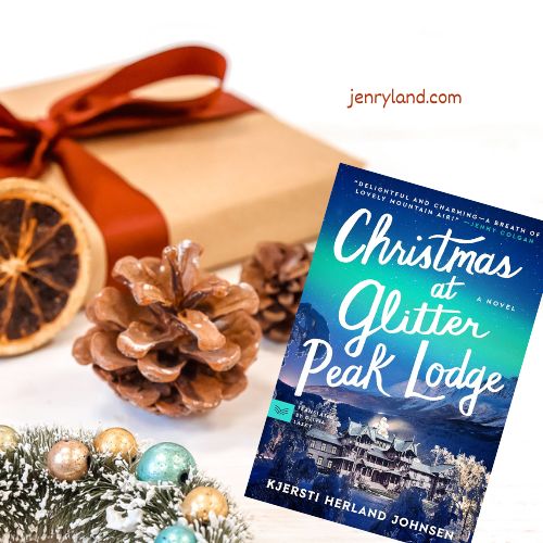 Copy of Christmas at Glitter Peak Lodge next to a wrapped present, some pine cones, and some glittery ornaments