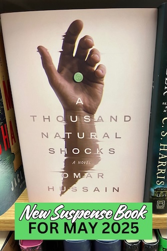 Photo of a copy of A Thousand Natural Shocks. The cover shows a hand holding a green pill