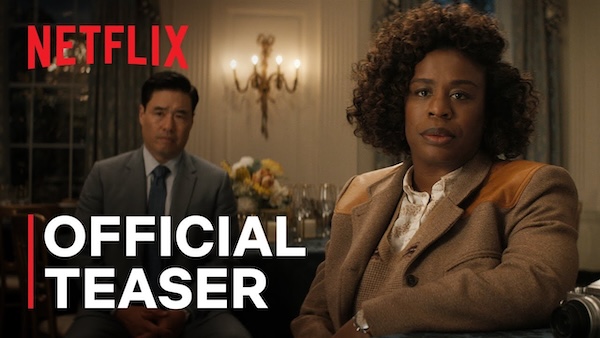 A black woman with curly hair stands in front of an Asian man in a formally decorated room