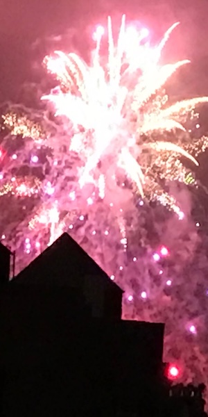 Fireworks above a roof