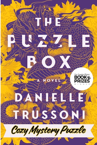 Cover of The Puzzle Box which has a purple dragon