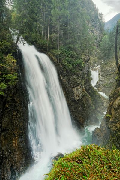 Picture of a waterfall tumbling down over cliffs