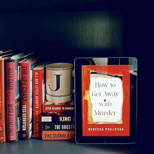 Original photo of How to Get Away With Murder on a bookshelf along with red books and a J mug