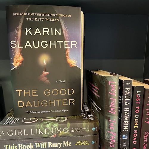 Copy of The Good Daughter on a stack of books